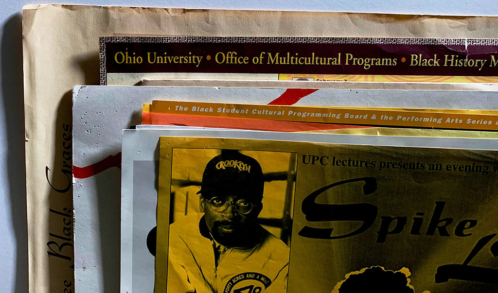 Pile of University Archives posters prior to image capture in Digital Initiatives.