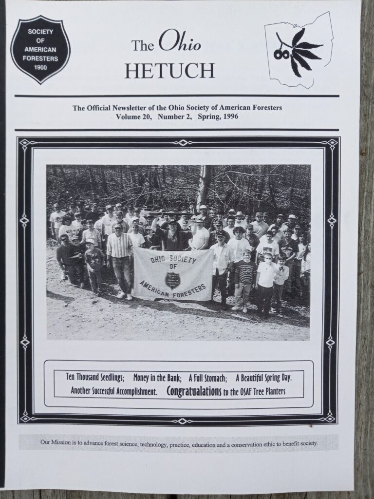 Cover of Hetuch newsletter with black and white image of members standing behind a OSAF banner.