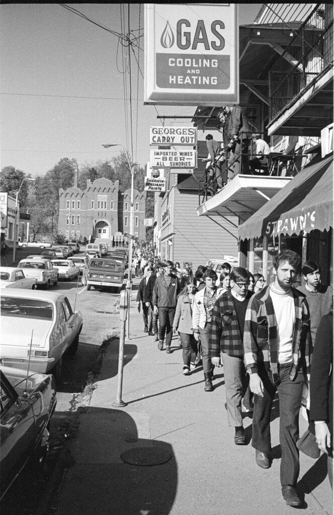 Students marching during the Vietnam War Moratorium on Court Street in uptown Athens, Ohio, 1969