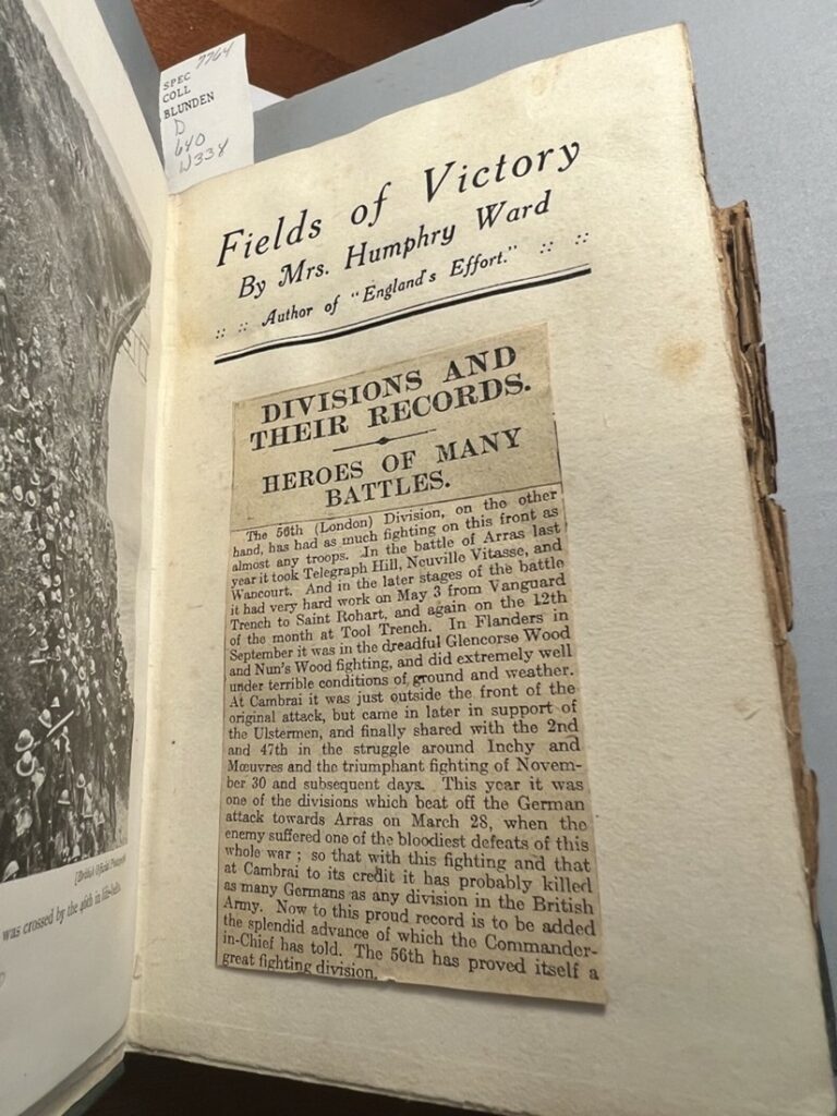 A newspaper clipping about WWI British army heroes pasted onto the title page of Mary Augusta Ward, Fields of Victory, 1919
