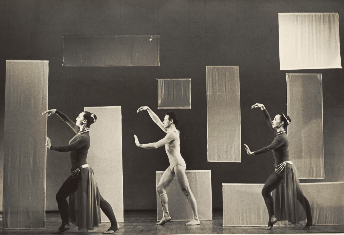 Three dancers onstage during a performance of "Nimbus", created by Alwin Nikolais