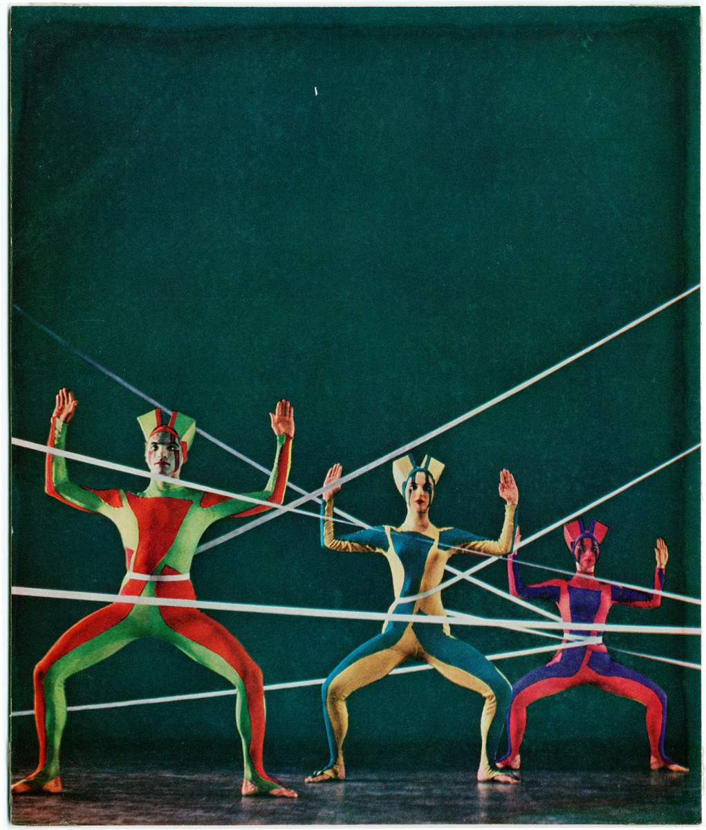 Three dancers in different colored costumes during a performance of "Web", later known as "Tensile Involvement", created by Alwin Nikolais