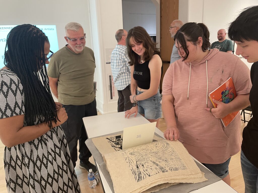 Artist Sauda Mitchell discussing her artists' book Voyage with event participants