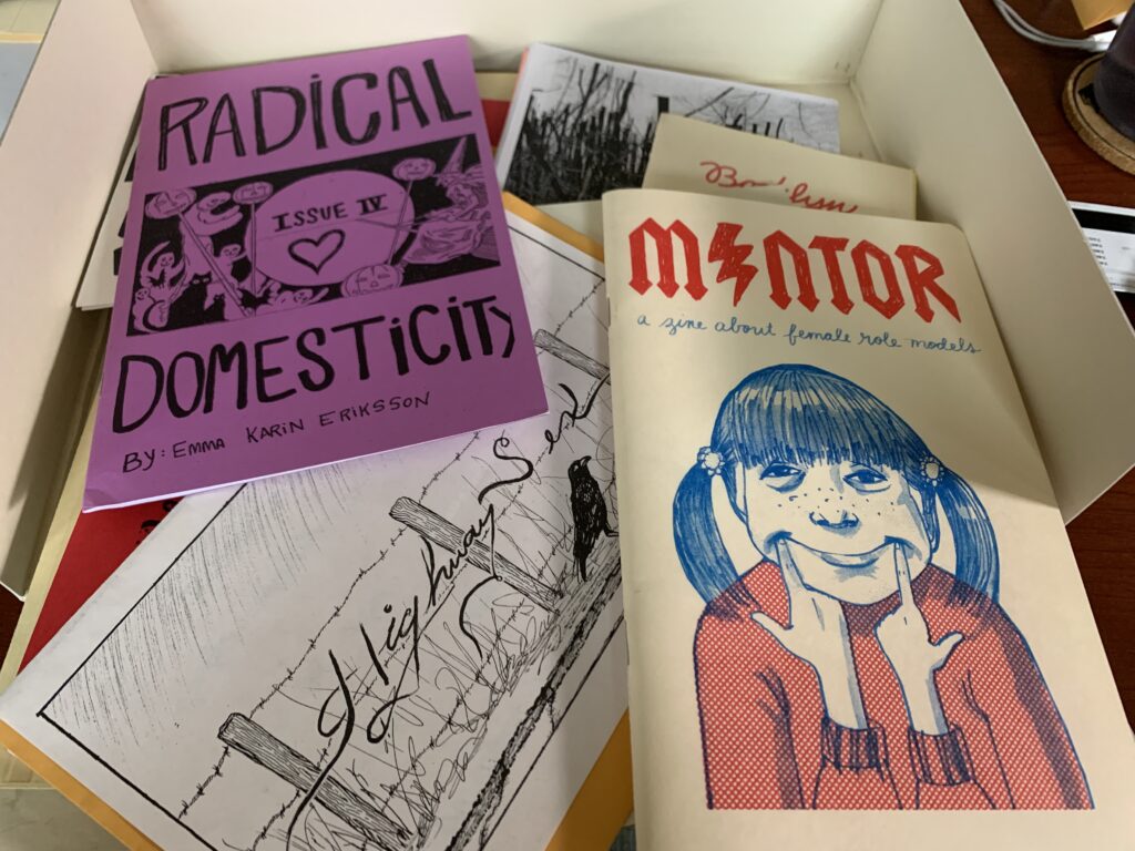 A box full of not-yet-organized zines.