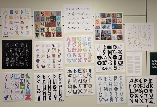 A selection of student-created alphabet posters on display.