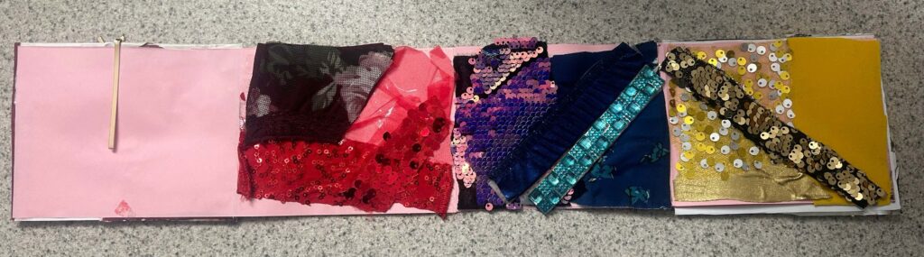 External view of Currier's book featuring cut up pieces of her own dance costumes.