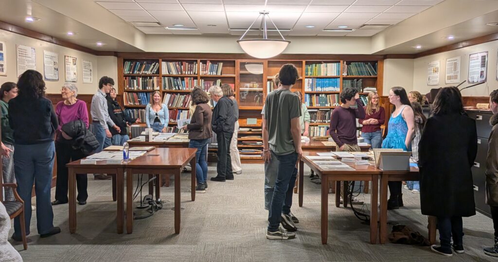Student employees and interns discuss collection materials with student, faculty, and community visitors during the Showcase.