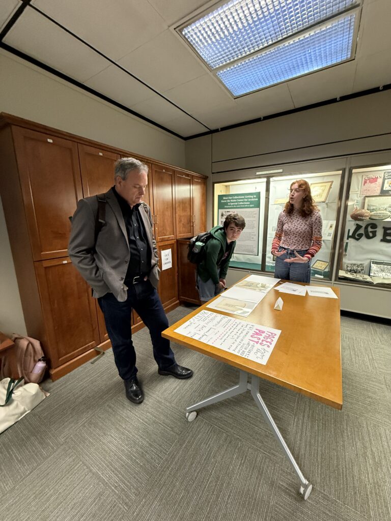 Student employees and interns discuss collection materials with student, faculty, and community visitors during the Showcase.