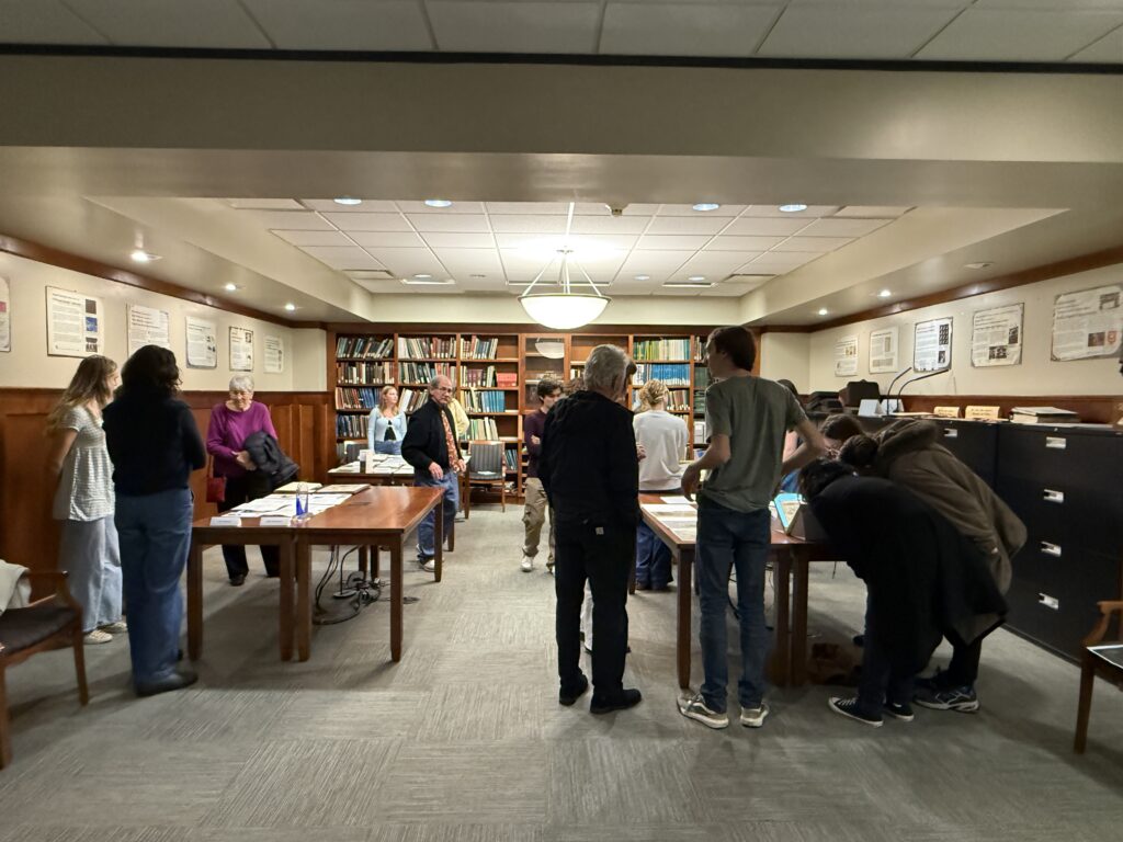Student employees and interns discuss collection materials with student, faculty, and community visitors during the Showcase.
