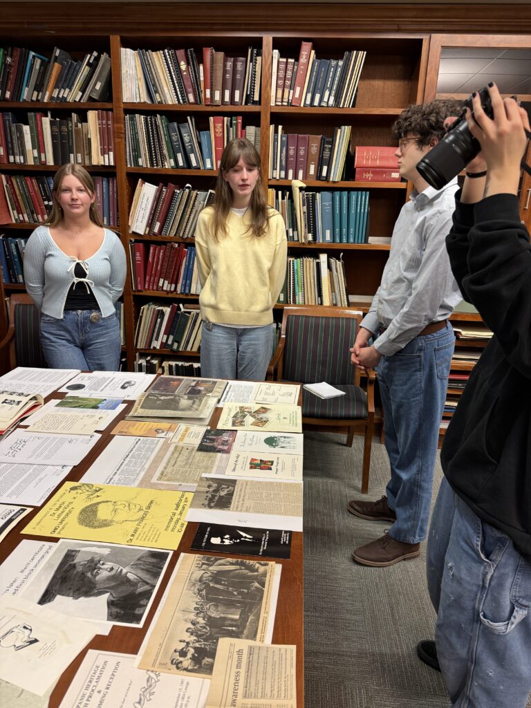 Student employees and interns discuss collection materials with student, faculty, and community visitors during the Showcase.