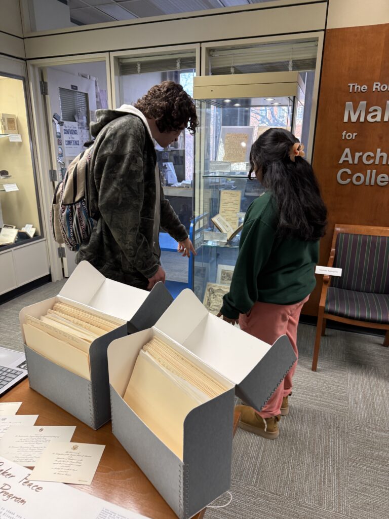 Student employees and interns discuss collection materials with student, faculty, and community visitors during the Showcase.